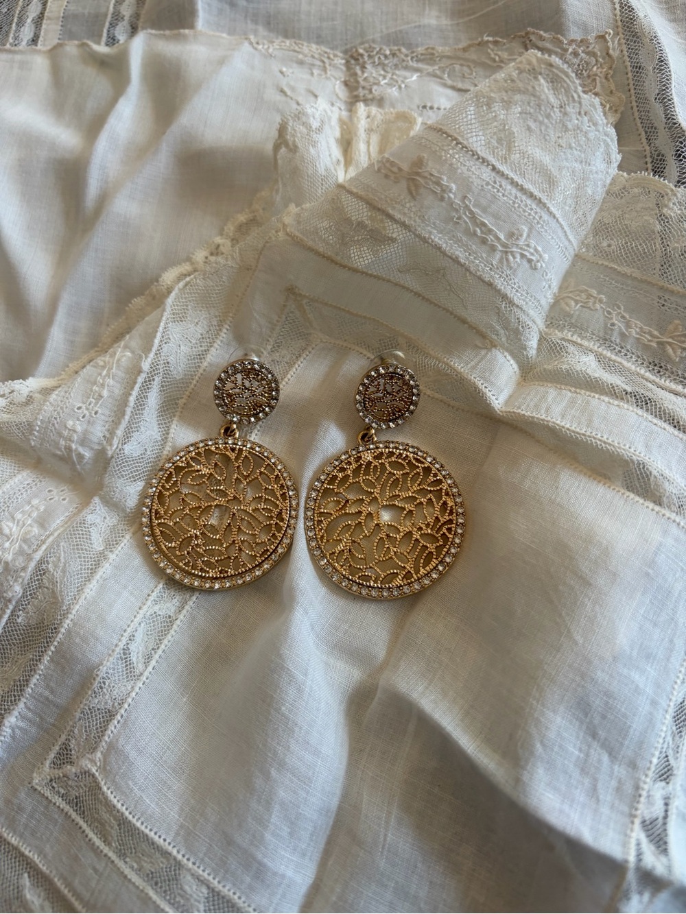Gold earrings with intricate floral filigree design #floral #filigree